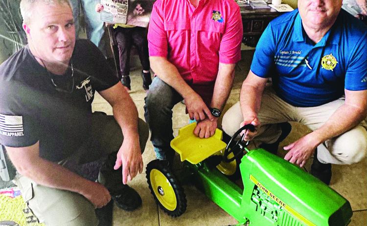 CPSO TOOTIE COOPER, (left) along with CPSO Sheriff Toney Edwards (center), and LPSO Joel Arnold at right, pictured here with restored family heirloom John Deere tractor.